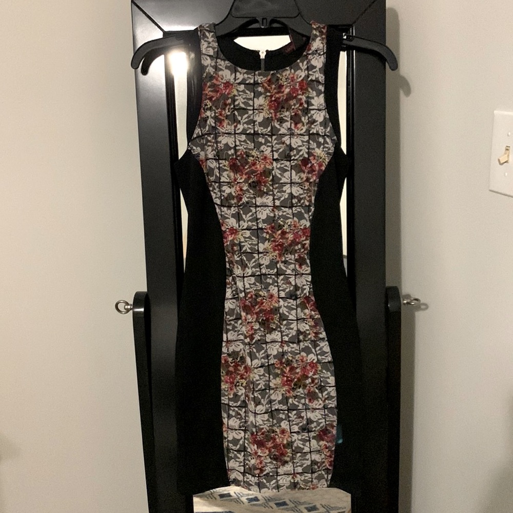 Form fitting black dress with flower lace down the front and back. Size Small